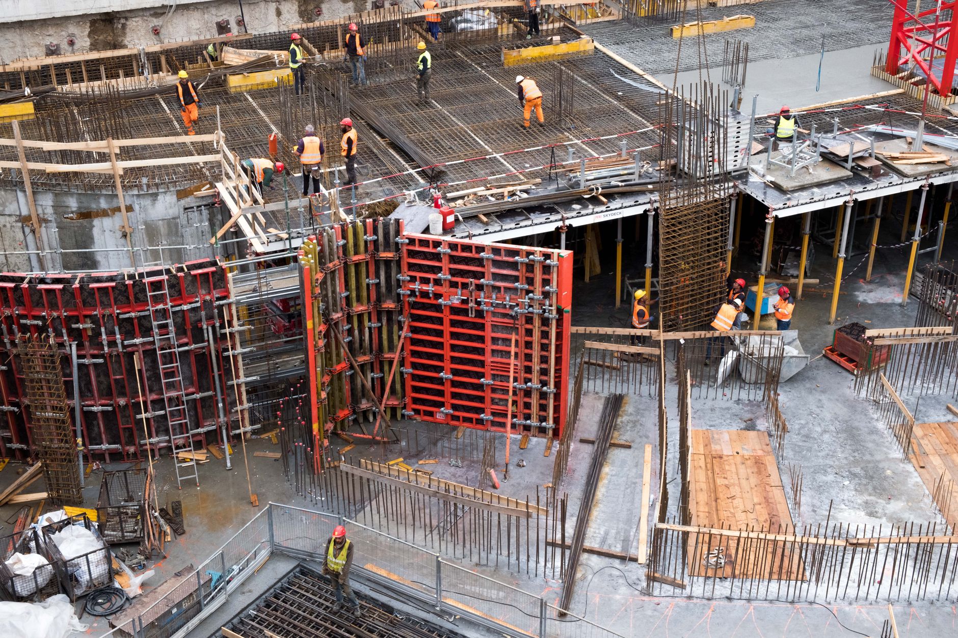 Construction site manager using a CRM on a tablet to track bids