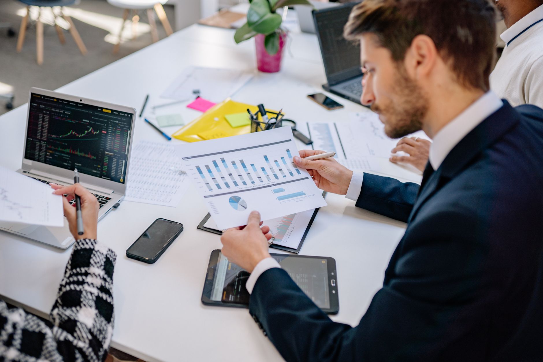 Sales rep scoring leads on a tablet without marketing automation