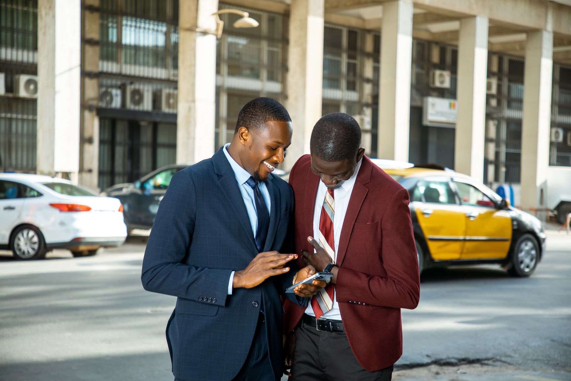 Two sales professionals reviewing a qualification checklist during a discovery call