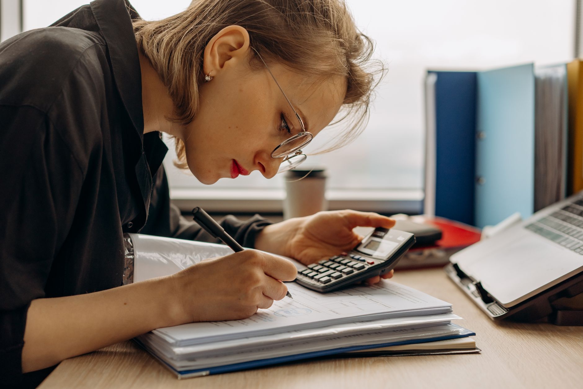 Account manager reviewing CRM dashboard data to plan customer retention strategy