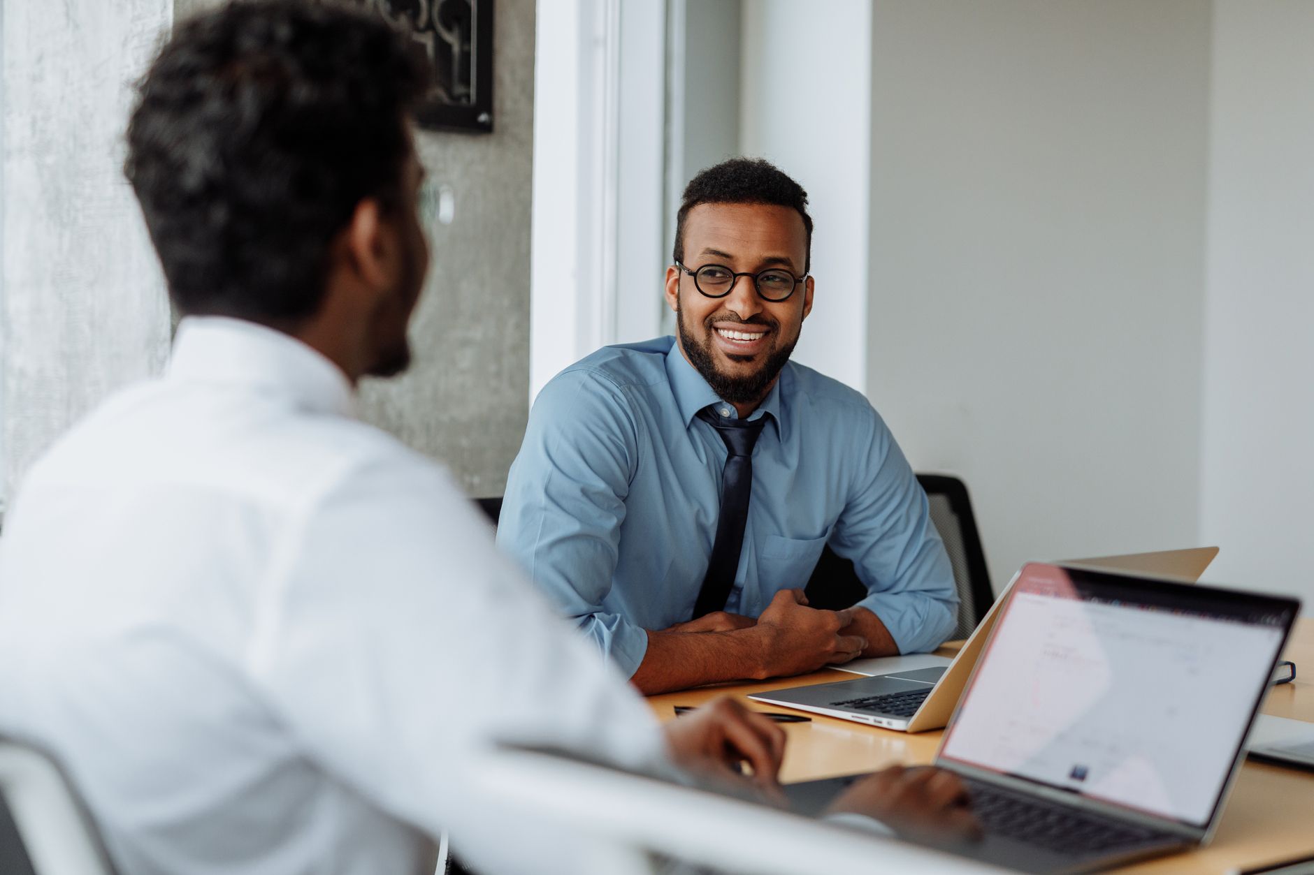 New sales rep at a laptop following a 30-60-90 CRM onboarding plan