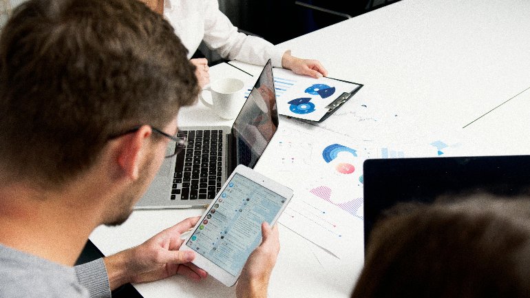 Person reviewing AI-generated CRM summary on a screen in a business setting